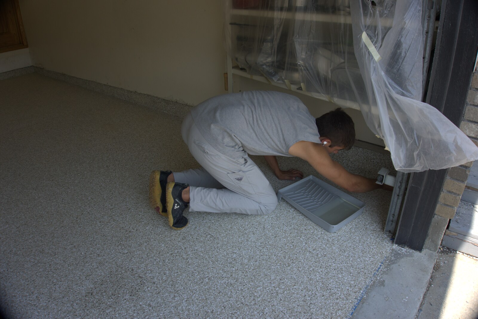 Concrete coating contractor applying polyaspartic system